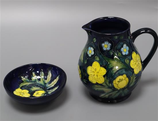 A Moorcroft buttercup style pattern baluster jug and a circular dish jug 15cm